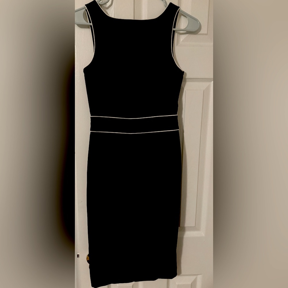 Express dress. Black, White piping. Size 1/2